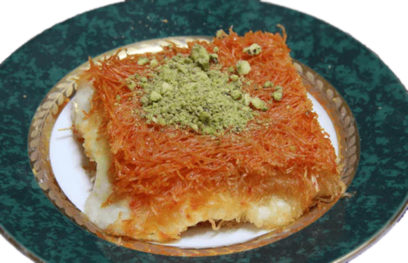 A plate with Kanafeh Nabulsi, a pastry, from Pâtisserie Le Caramel in Ottawa Ontario.